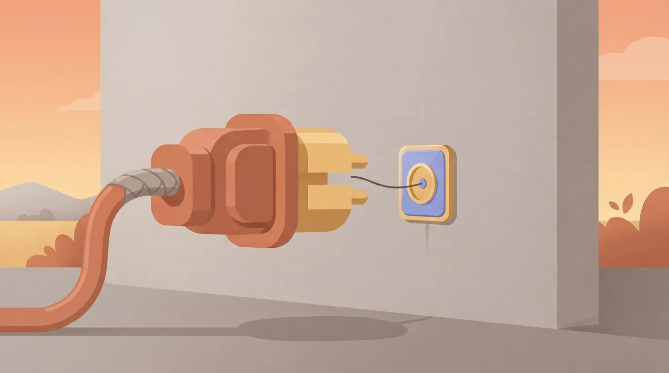 A large, heavy-duty industrial power plug with a thick cable, plugged into a socket that is only as wide as a single thin…